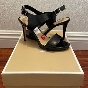 NWT Michael Kors heeled sandals in black leather.